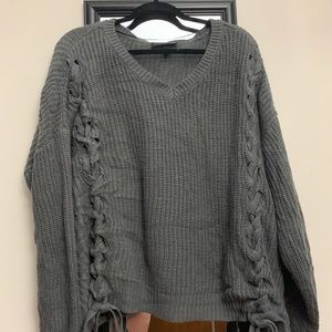 Lane Bryant V-neck grey sweater with ties.